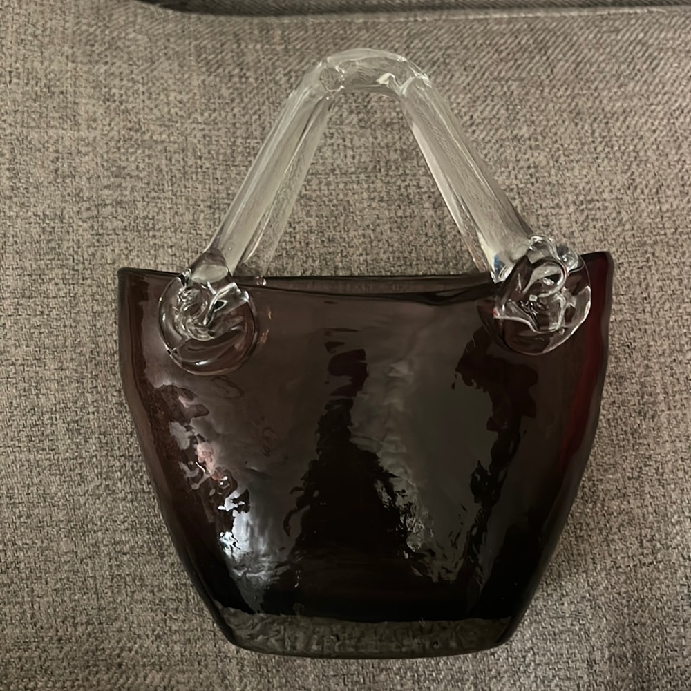 Small purple hand blown glass hand bags.